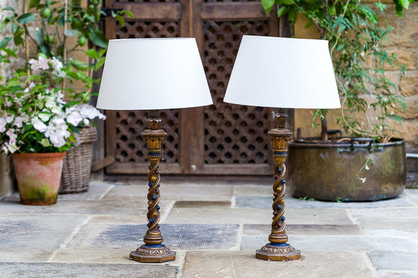 Offbeat Interiors - A Pair of Polychrome and Gilt Painted Lamps