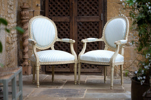 Offbeat Interiors - A pair of French painted fauteuils