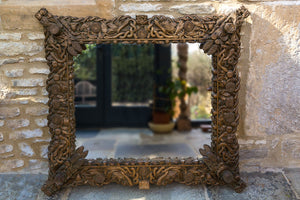 Offbeat Interiors - Carved gilt wood framed wall mirror