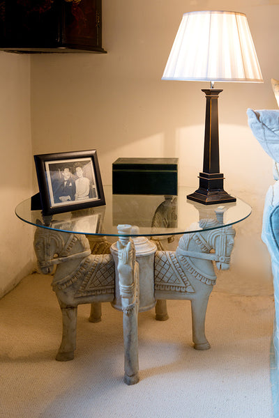 Offbeat Interiors - A pair of marble horse head tables
